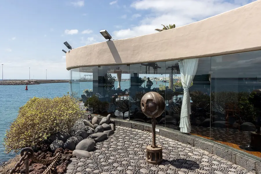 Glass-walled restaurant of the Castillo de San José above the harbour, Arrecife